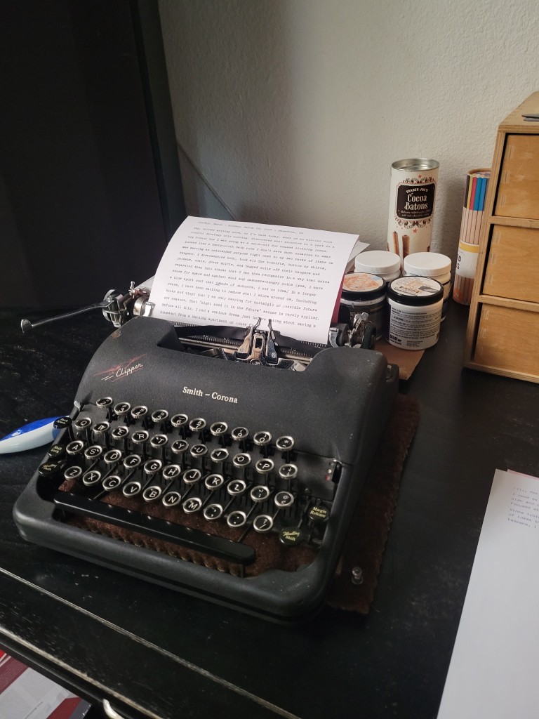Smith-Corona Clipper on a desk with a typed page